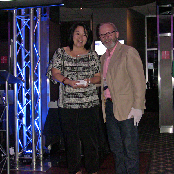 Saori Yamamoto (Vancouver Coastal Health/CEAN) receives P2 for the Greater Good Award from Bruce